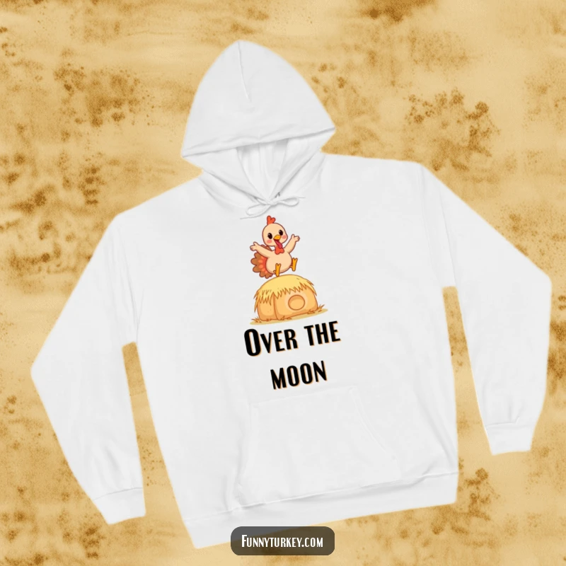 Funny Kawaii Turkey Hoodie featuring a happy cartoon turkey leaping gracefully over a hay bale, perfect for cozy and humorous seasons.