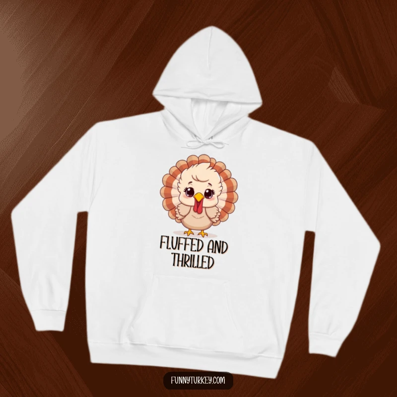 Funny hoodie featuring a cartoon turkey with ruffled feathers and a happy surprised look, offering warm, humorous holiday comfort.